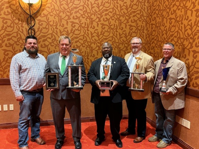 ABF Freight drivers with the Arkansas TDC team trophy
