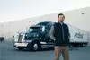 dedicated driver standing in front of a truck