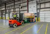 Forklift with MP Coupler removes Vaux MP from a trailer in one swift movement.