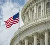 U.S. flag waving in front of the Capitol Building.