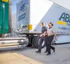 ABF employees walking around an ABF semi truck