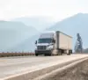 Semi truck driving down the highway